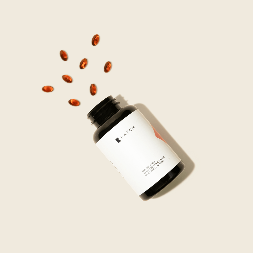 full spectrum cbd softgels spread out of container. 